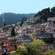 Historic row houses terraced into a verdant hill